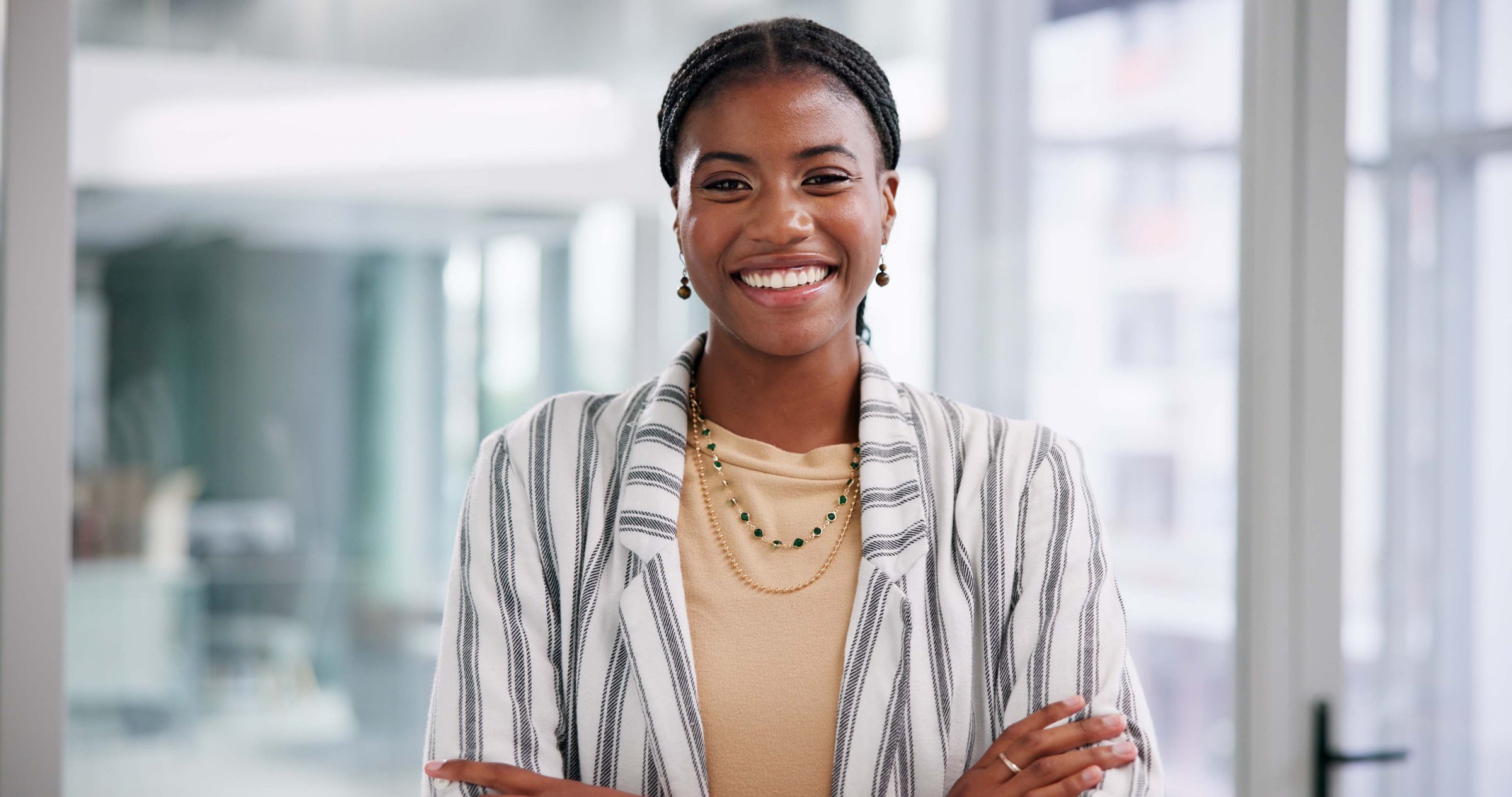 Business, portrait and smile with black woman in office for start of corporate or professional career. Confident, creative and mission with happy employee at design agency workplace in Nigeria